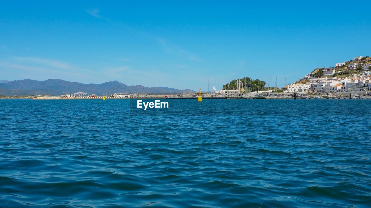 Scenic view of sea against blue sky