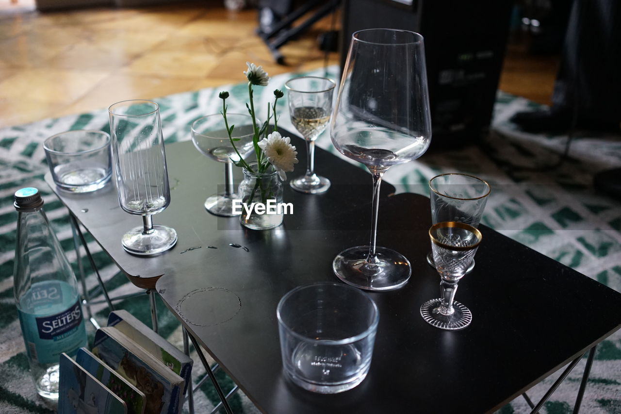 Close-up of wine glasses on table