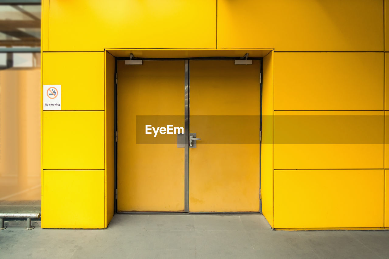 YELLOW DOOR OF BUILDING