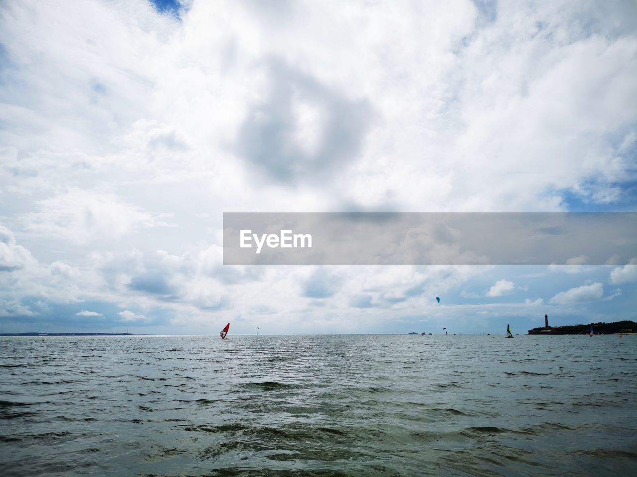 PEOPLE ON SEA AGAINST SKY