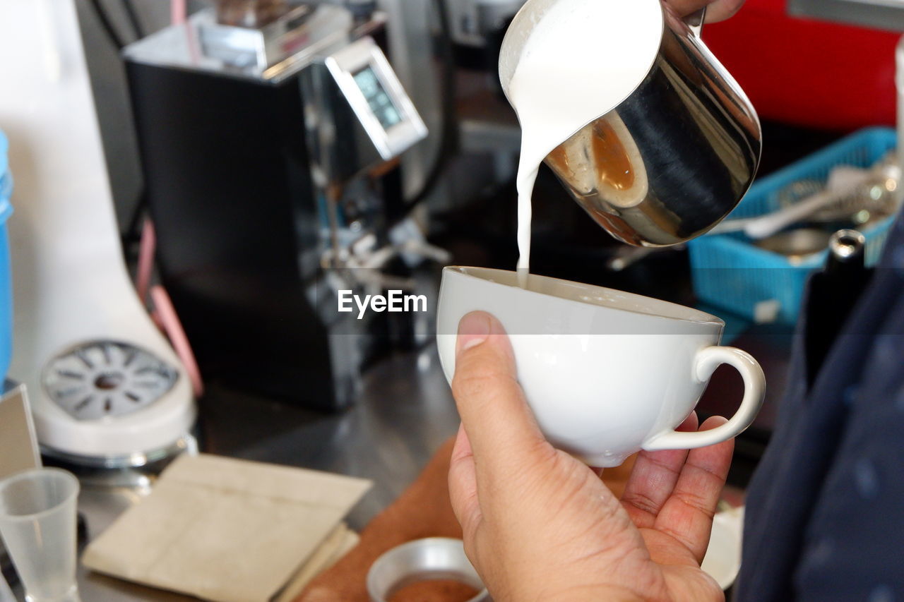 MIDSECTION OF COFFEE CUP WITH TEA