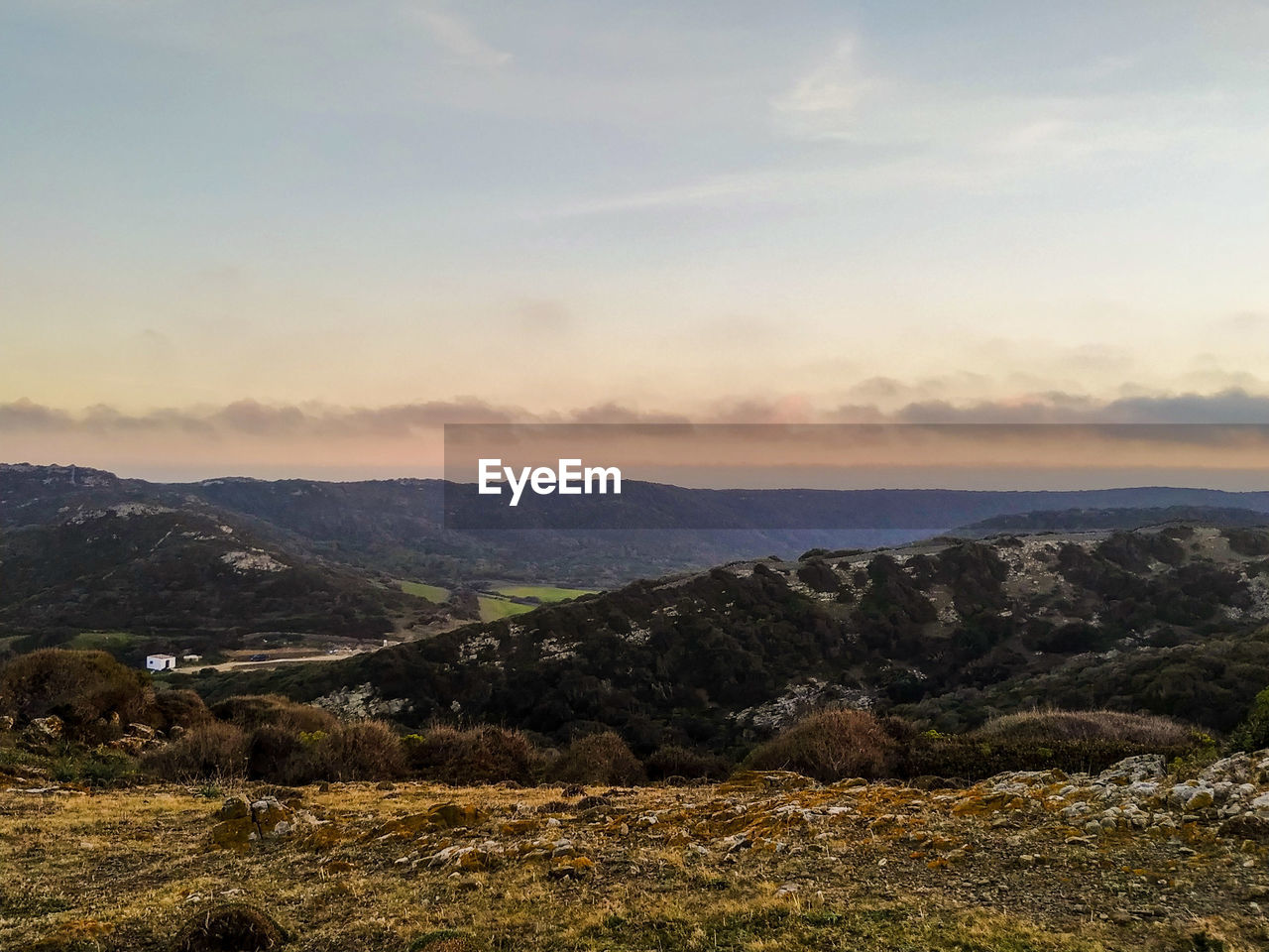 Scenic view of landscape against sky during sunset