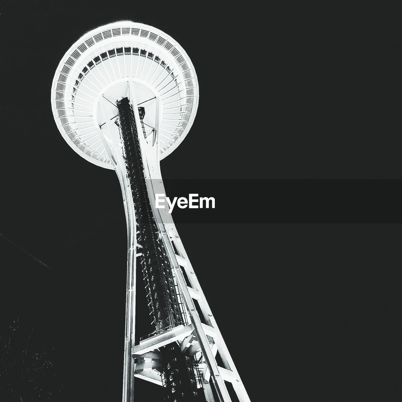 LOW ANGLE VIEW OF ILLUMINATED FERRIS WHEEL AGAINST CLEAR SKY