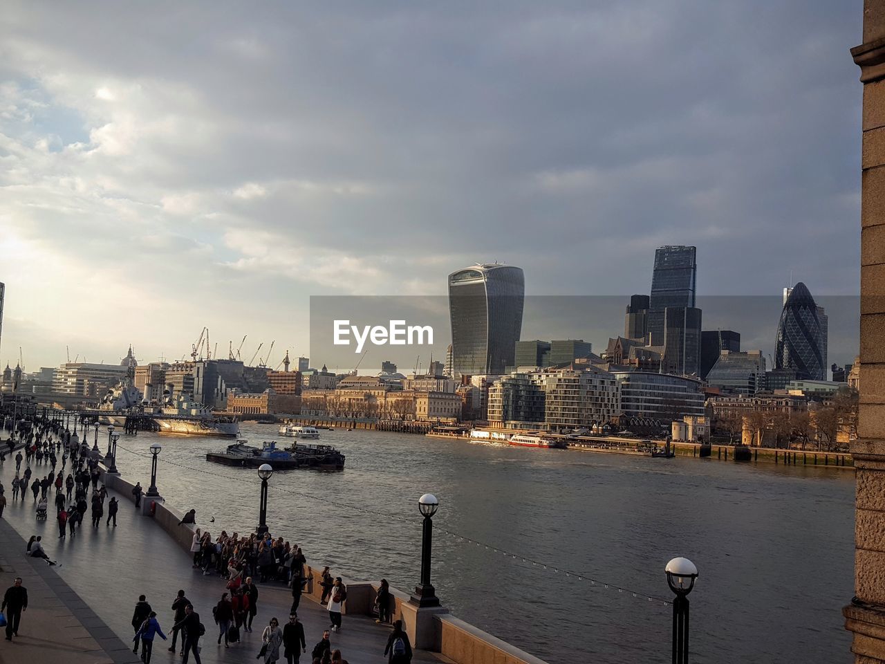 Cityscape against cloudy sky