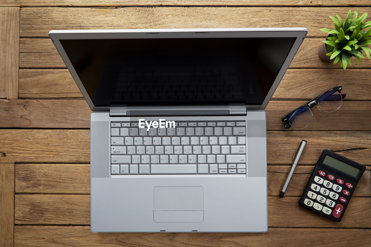 Directly above view of laptop on wooden desk