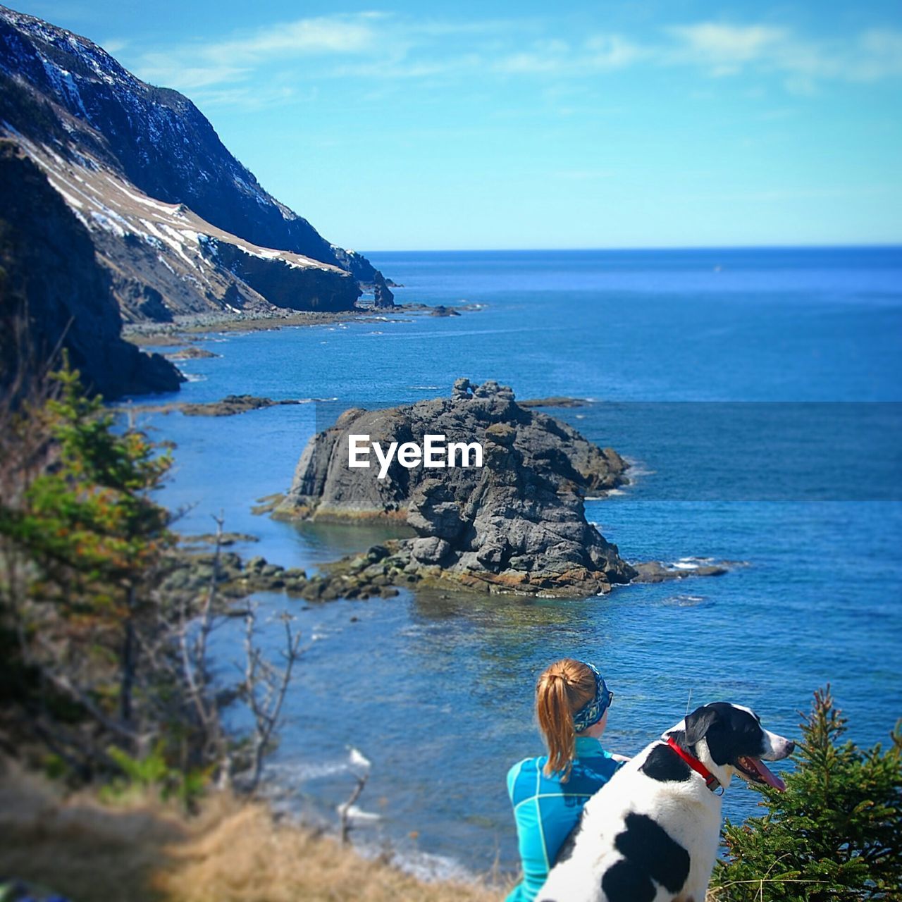 SCENIC VIEW OF SEA WITH MOUNTAIN IN BACKGROUND