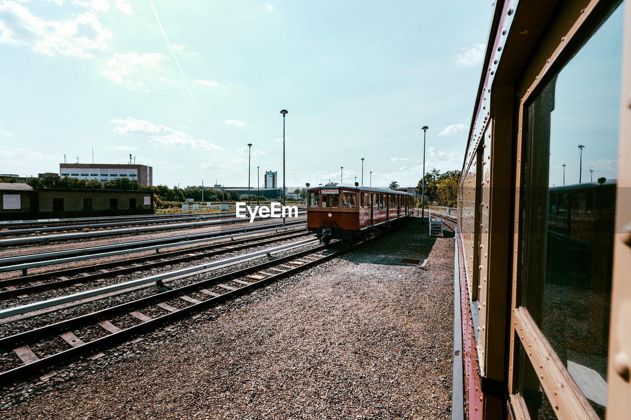 Trains on track against sky