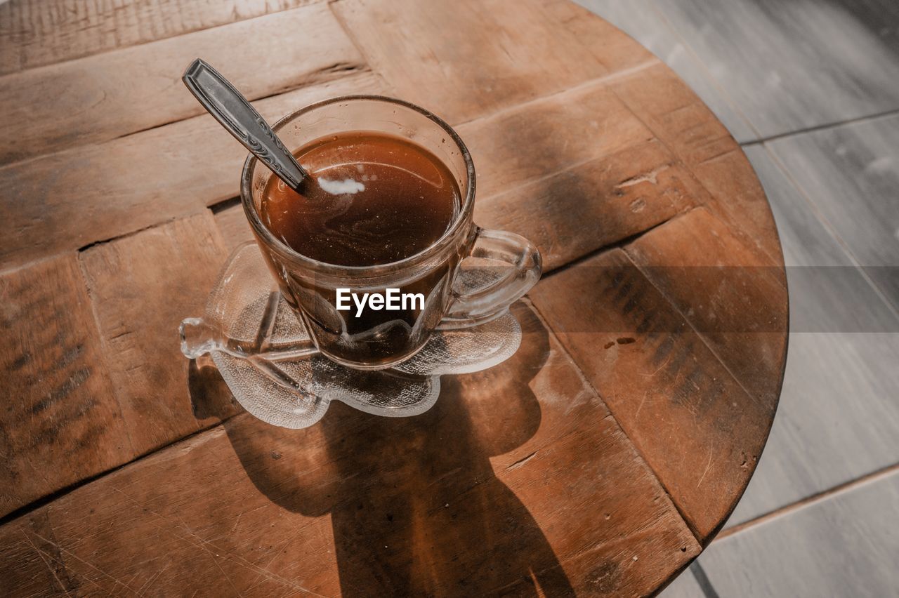 High angle view of coffee cup on floor