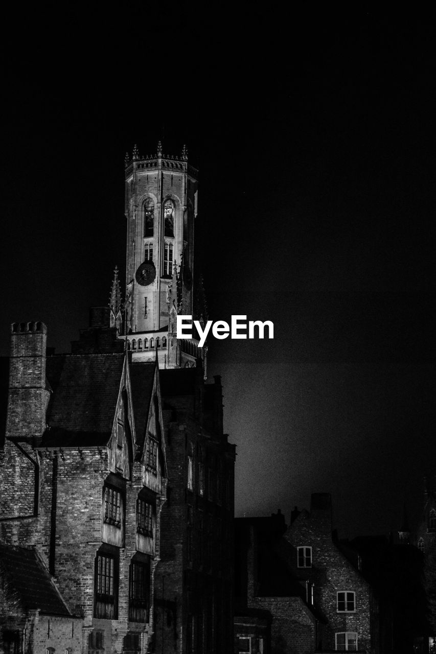 LOW ANGLE VIEW OF A CLOCK TOWER