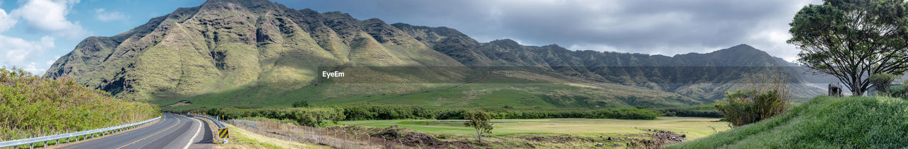 Panoramic view of road amidst mountains against sky