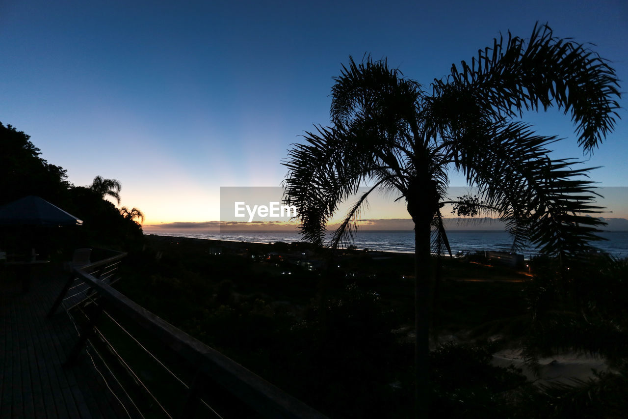 Scenic view of landscape against sky at sunset