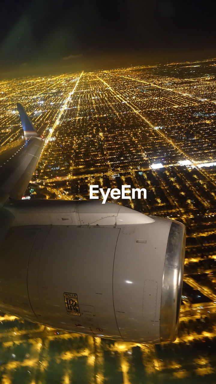 Aerial view of illuminated city from aircraft