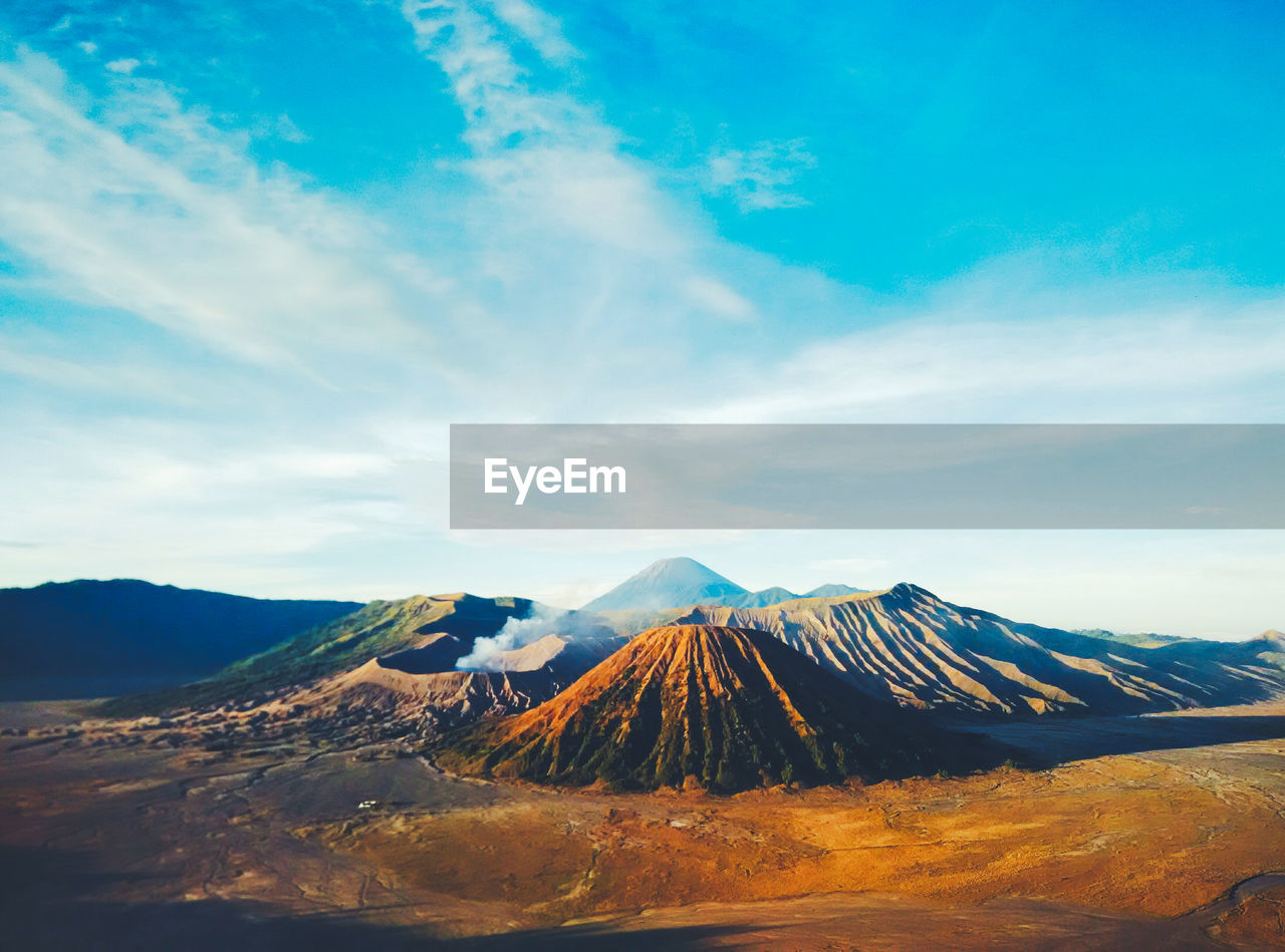 Mountains against cloudy sky