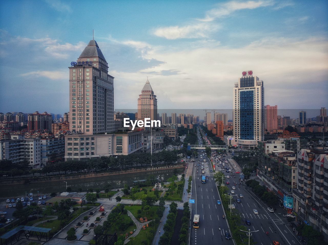 High angle view of street amidst buildings against sky