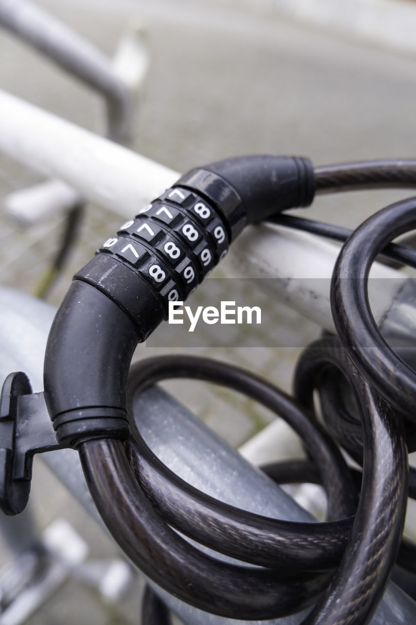 iron, wheel, bicycle, close-up, focus on foreground, vehicle, no people, metal, technology, steering wheel, cable, communication, day, black