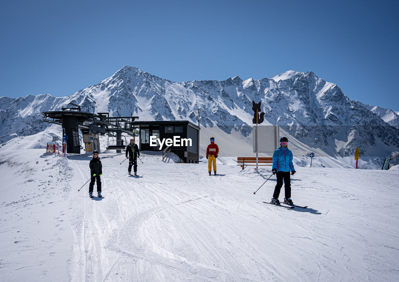 Family in the ski area in tirol near the chair lift