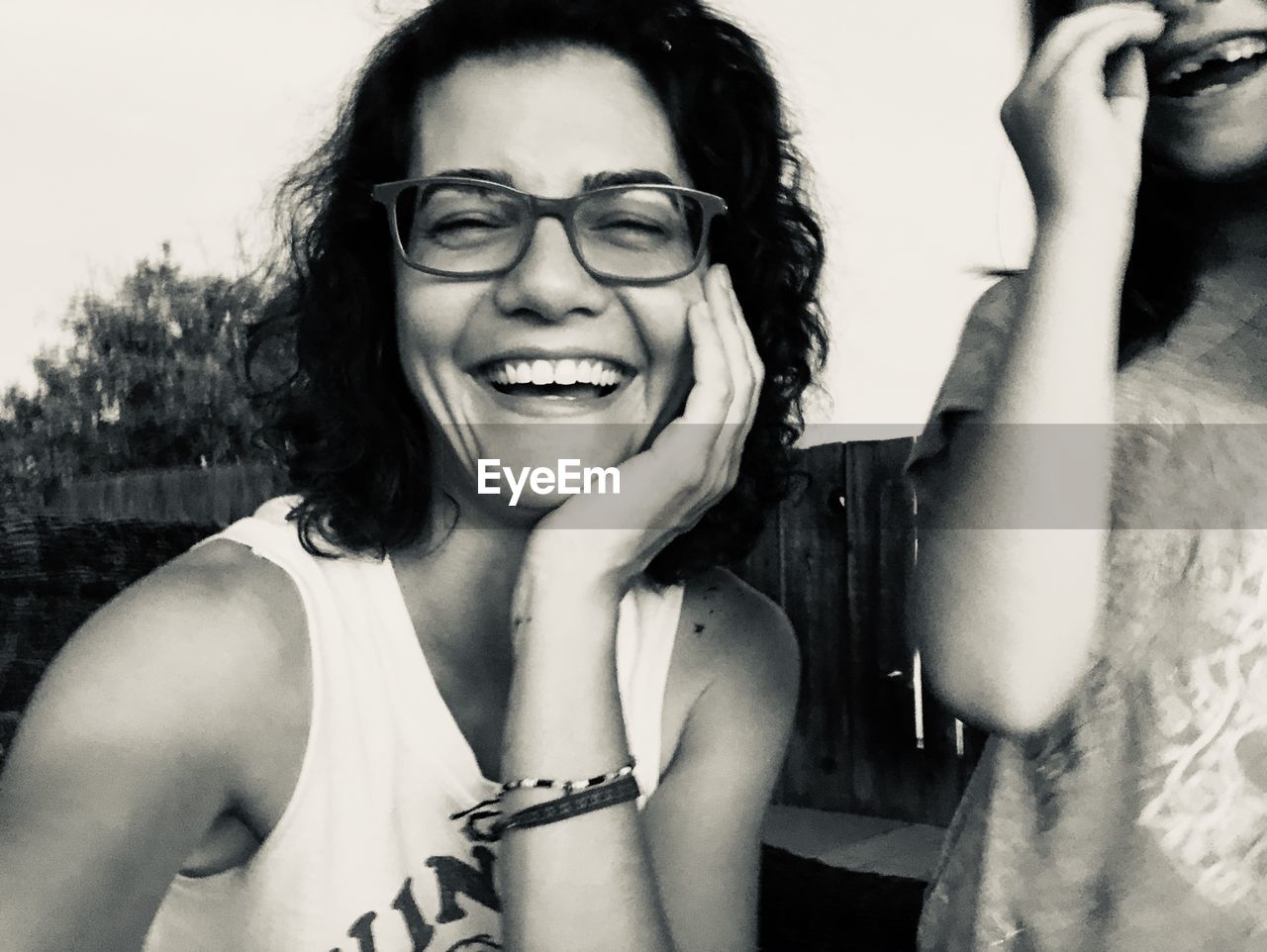 Portrait of cheerful mature woman wearing eyeglasses