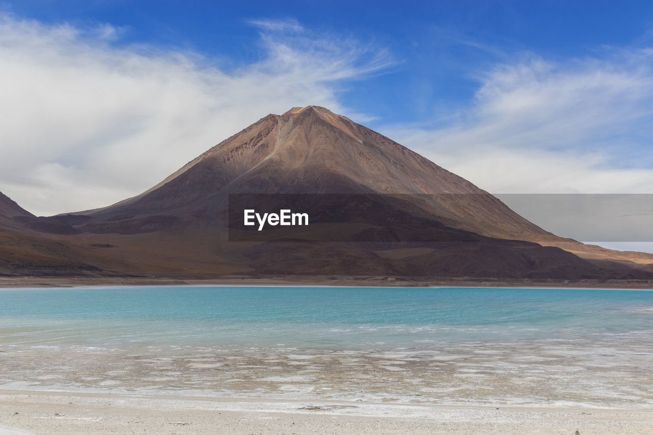 SCENIC VIEW OF MOUNTAIN AGAINST CLOUDY SKY