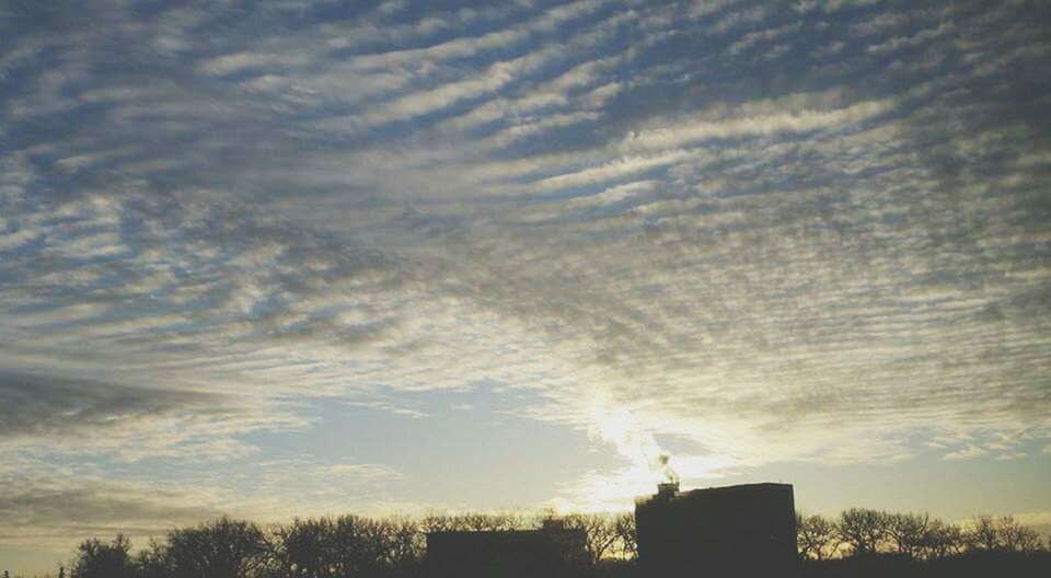 LOW ANGLE VIEW OF CLOUDY SKY OVER SUNSET