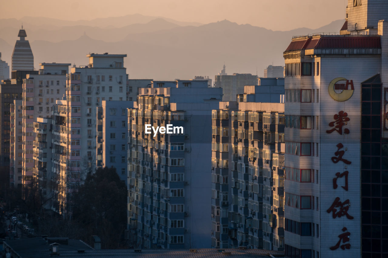 View of cityscape against sky during sunset