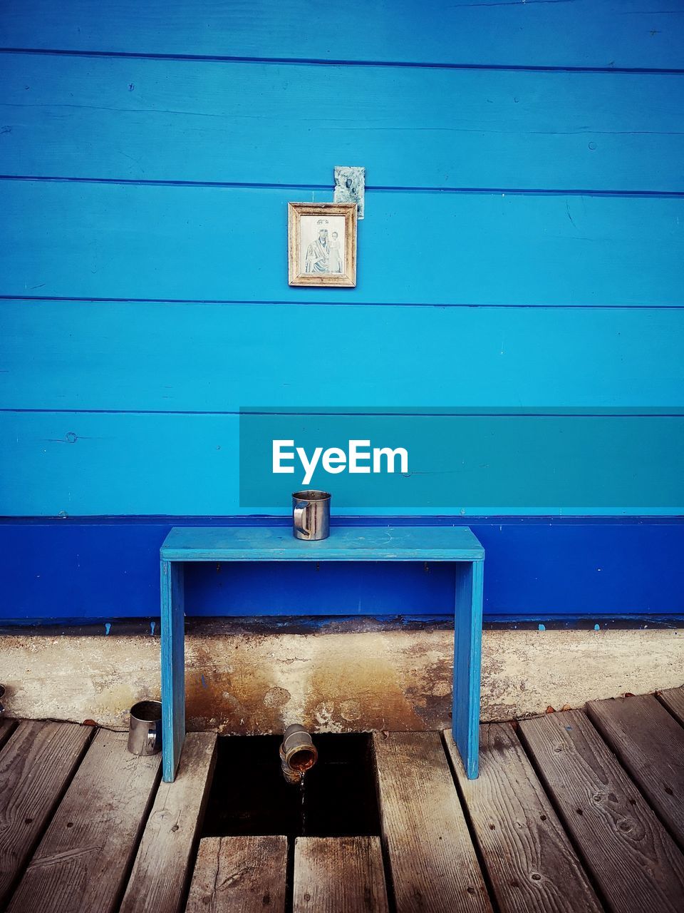 CLOSED WOODEN DOOR OF BLUE HOUSE