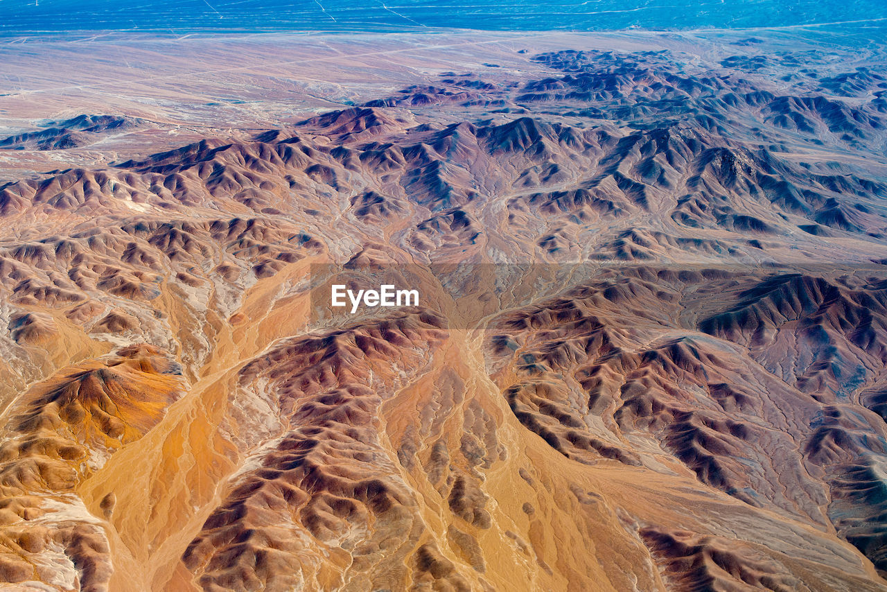 Aerial view of dry rivers and mountains in the altiplano of the atacama desert, chile.