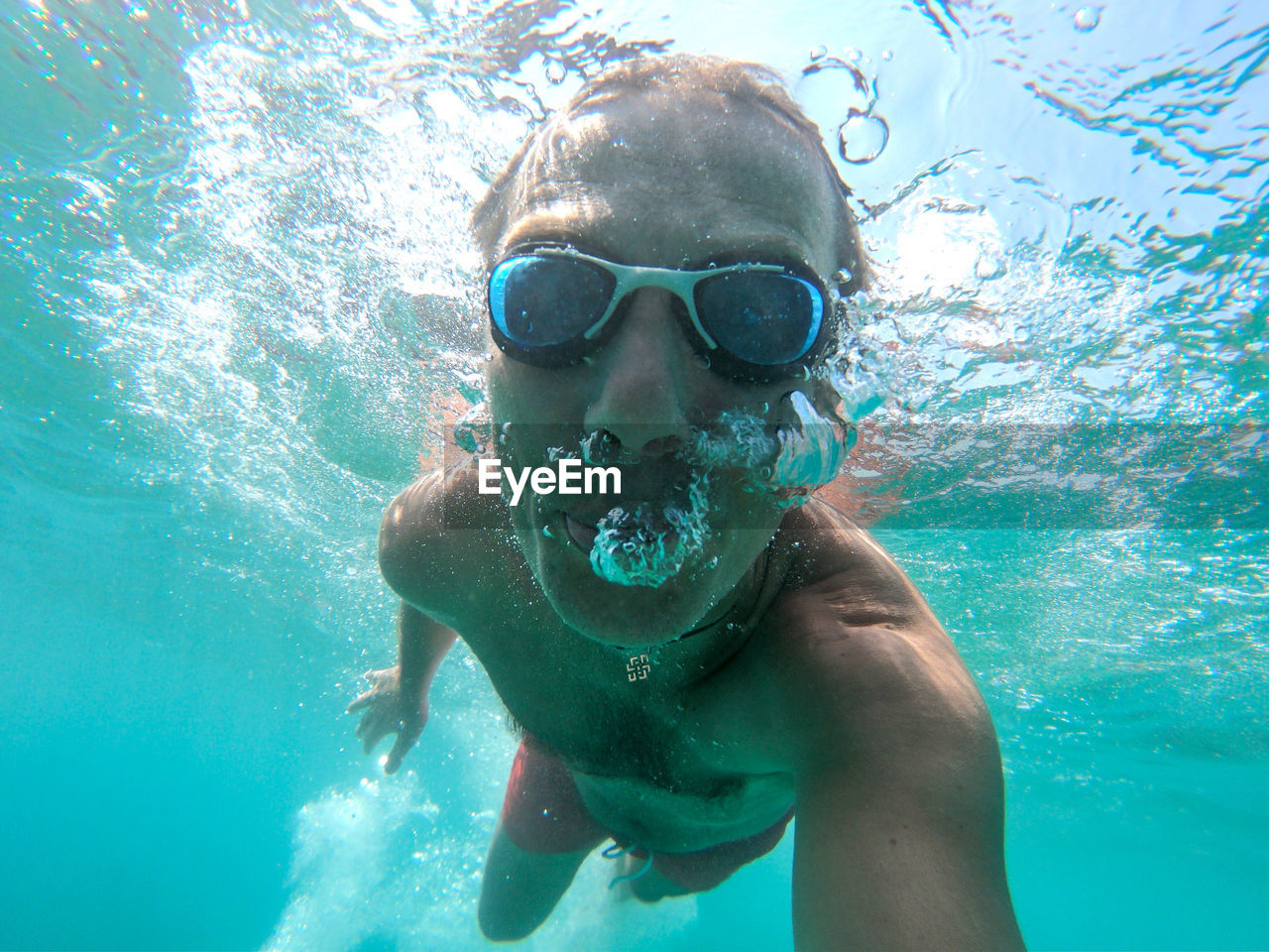 Portrait of man swimming in sea