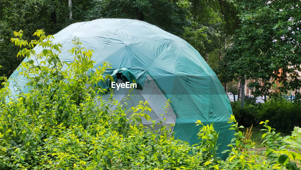 Large green dome geodesic tent for camping. tourism concept