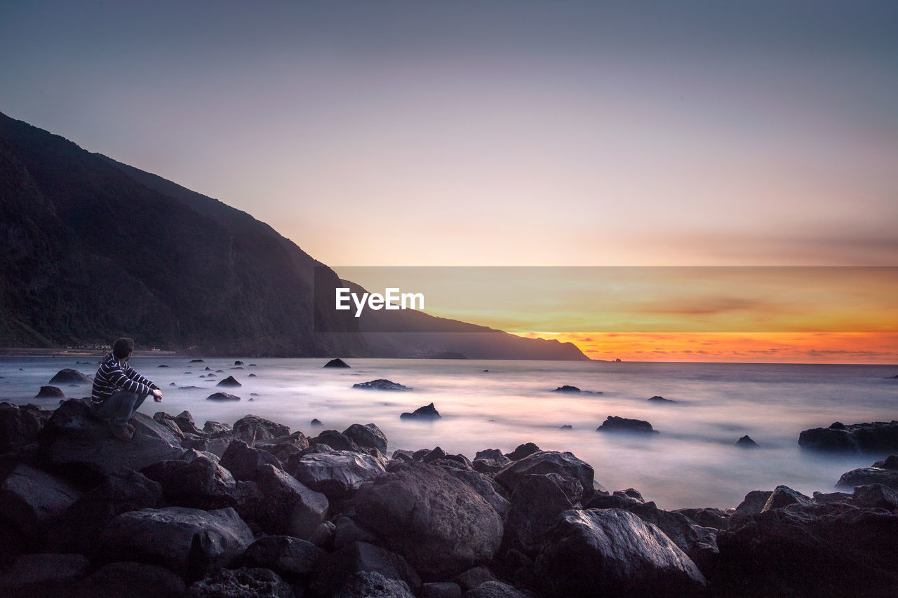 Scenic view of sea against sky during sunset