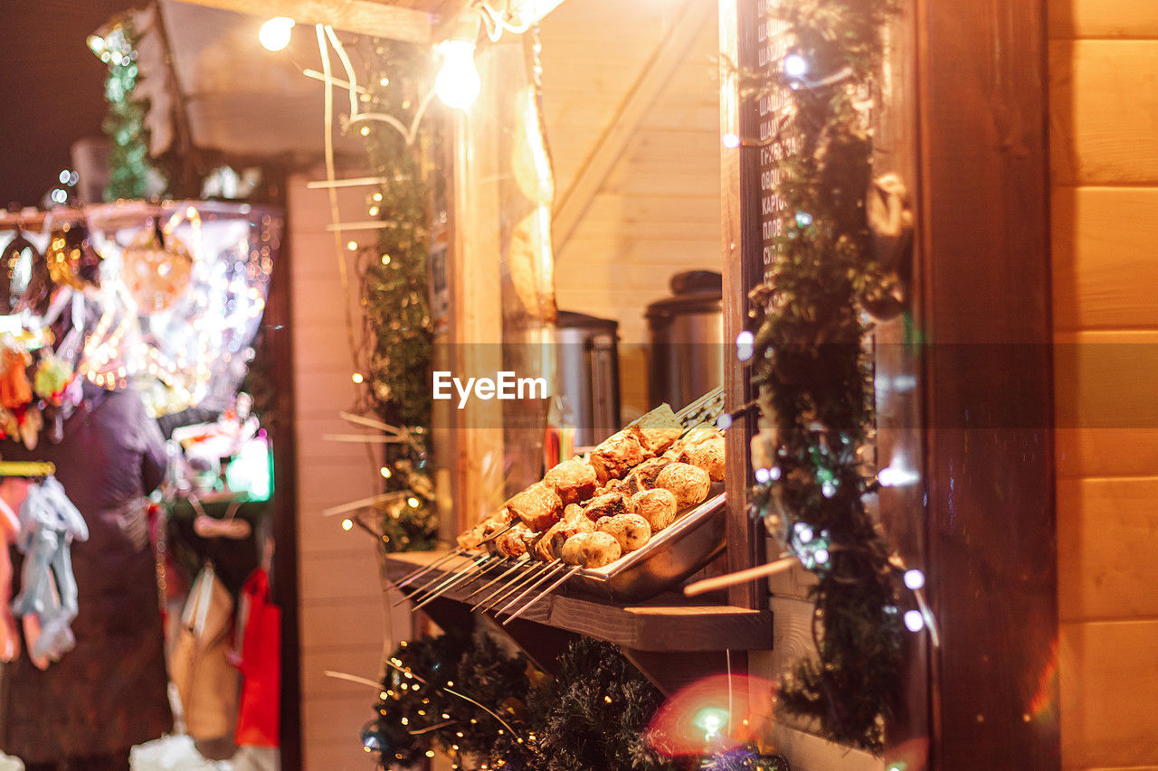 christmas tree, holiday, christmas, retail, celebration, illuminated, store, food and drink, christmas decoration, meal, decoration, business, no people, food, hanging, night, market, lighting equipment, nature, christmas lights, tree, shopping, tradition, indoors