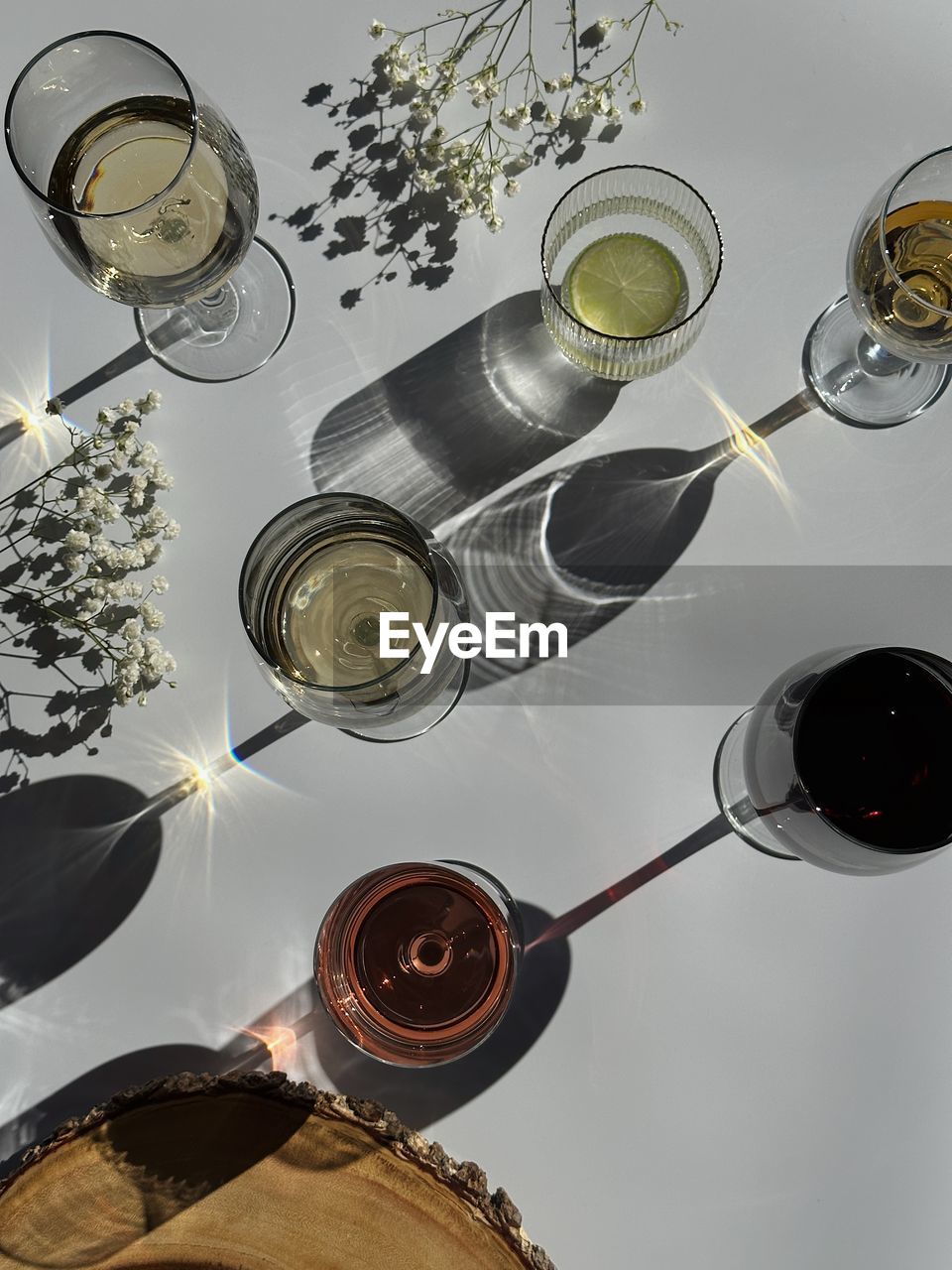 food and drink, glass, drink, household equipment, refreshment, high angle view, directly above, drinking glass, no people, indoors, still life, alcohol, lighting, food, wine, kitchen utensil, nature, wine glass, studio shot, circle, plant, table, container
