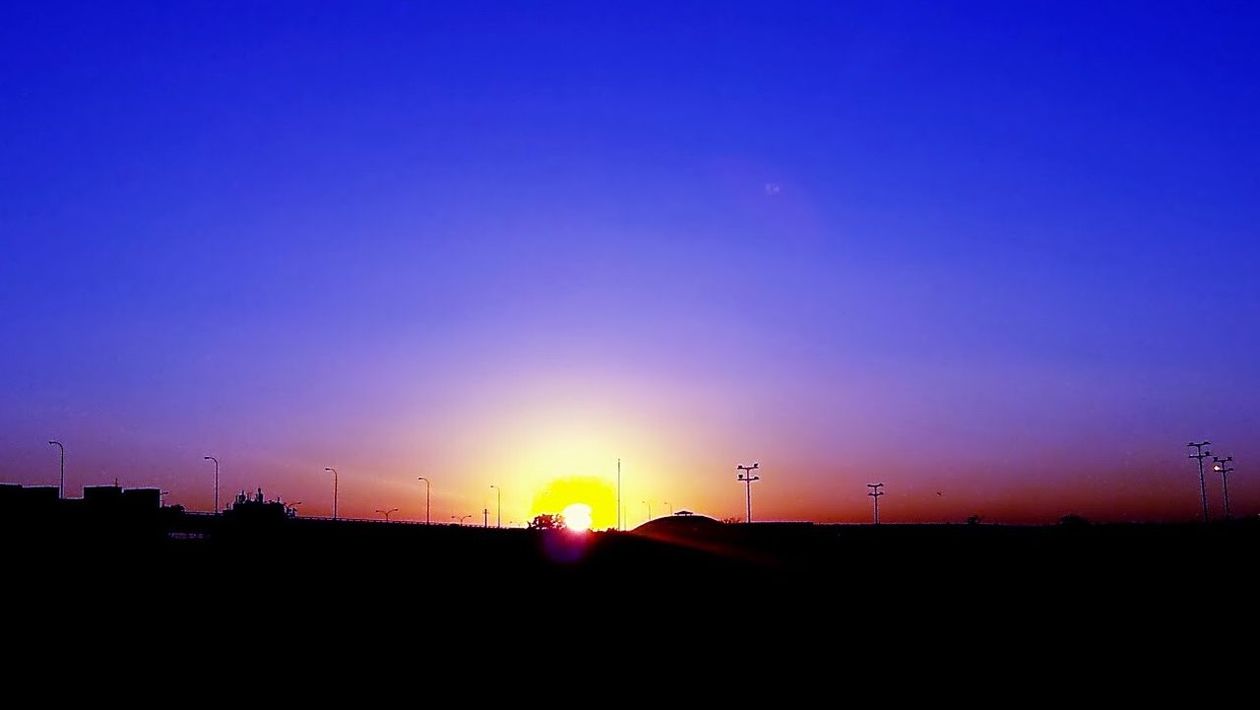 SCENIC VIEW OF SUNSET OVER LANDSCAPE