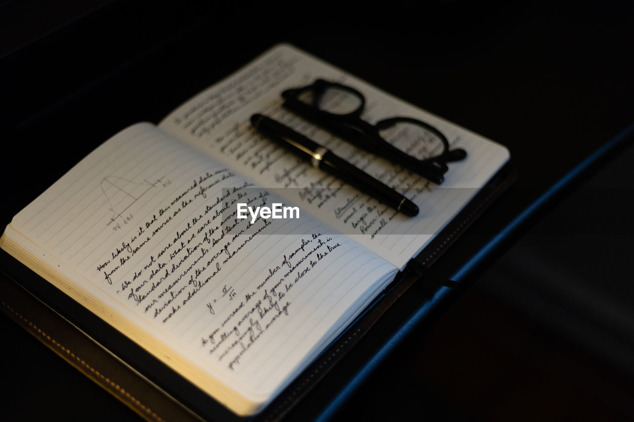 High angle view of handwritten text on note book
