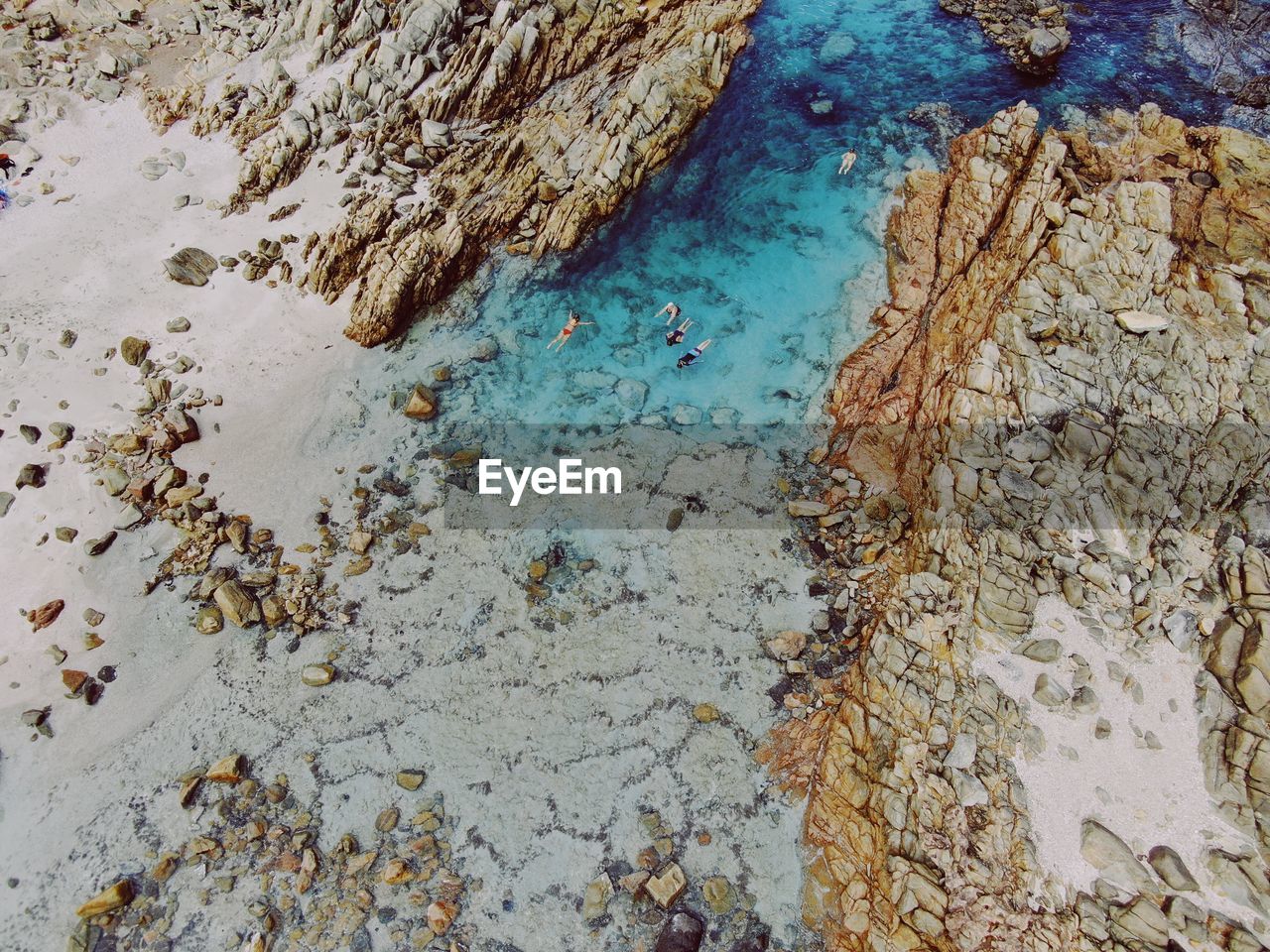 Aerial view of rock formation at beach