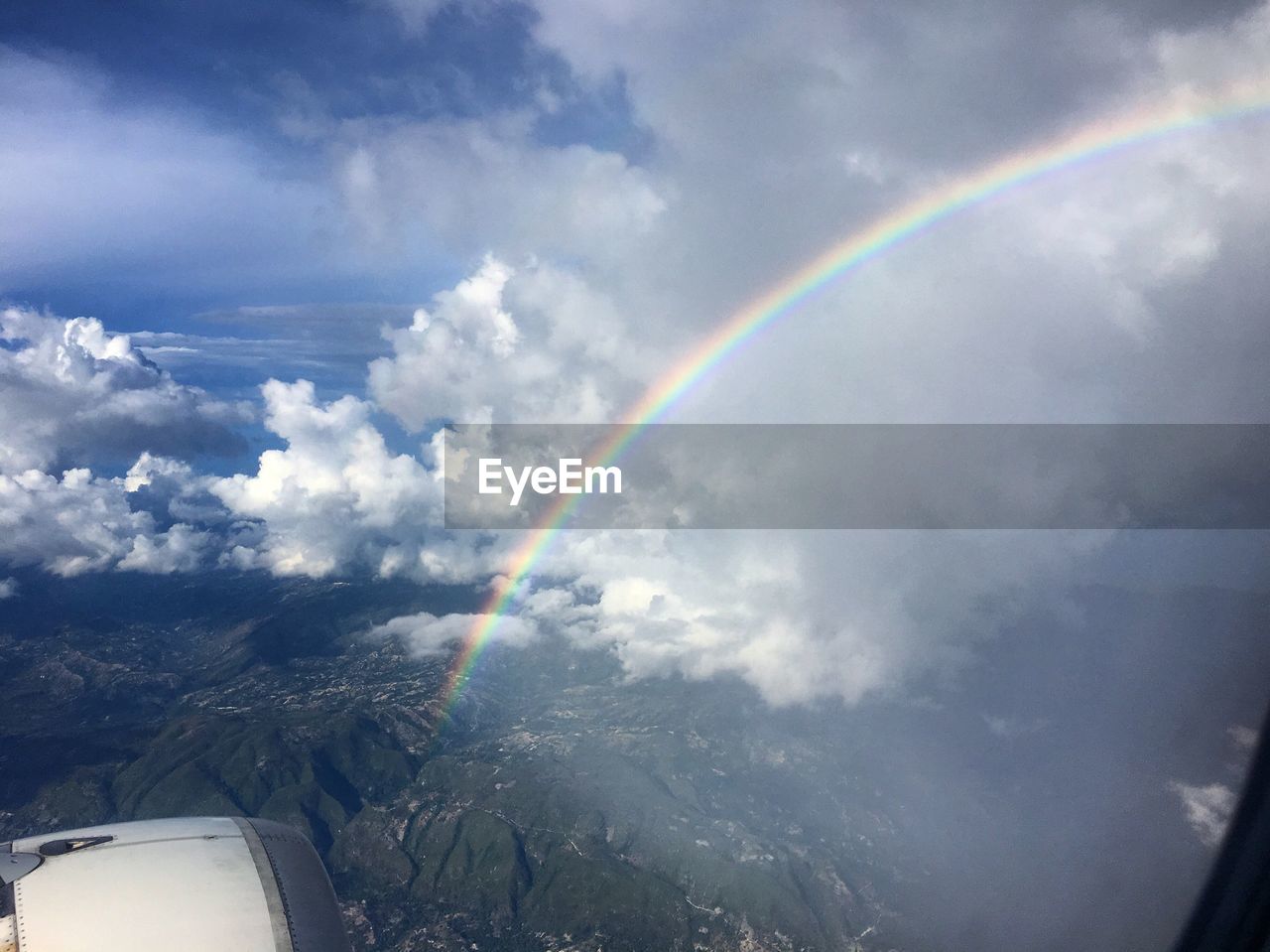 SCENIC VIEW OF RAINBOW OVER LANDSCAPE