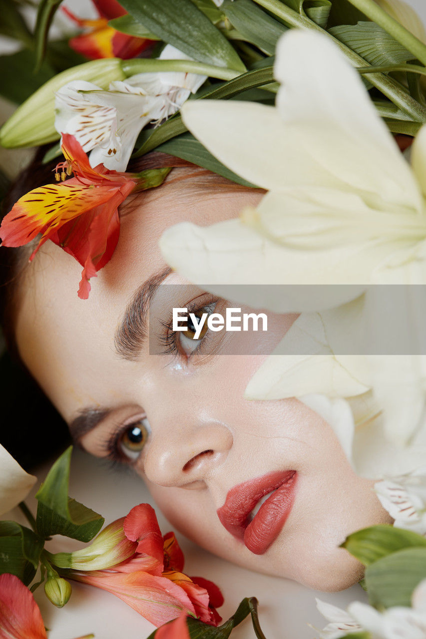 portrait, women, flower, plant, one person, adult, young adult, flowering plant, looking at camera, beauty in nature, make-up, pink, nature, headshot, female, bouquet, human face, fashion, rose, plant part, leaf, bride, freshness, indoors, food, sweetness, close-up, emotion, lifestyles, food and drink, lipstick, red, celebration, skin, elegance, eye, person, looking, studio shot, cute, decoration, petal, wellbeing