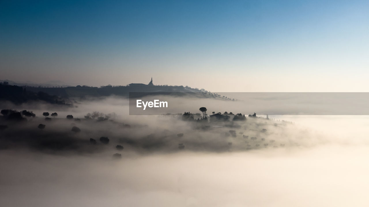 Scenic view of landscape against sky during sunset