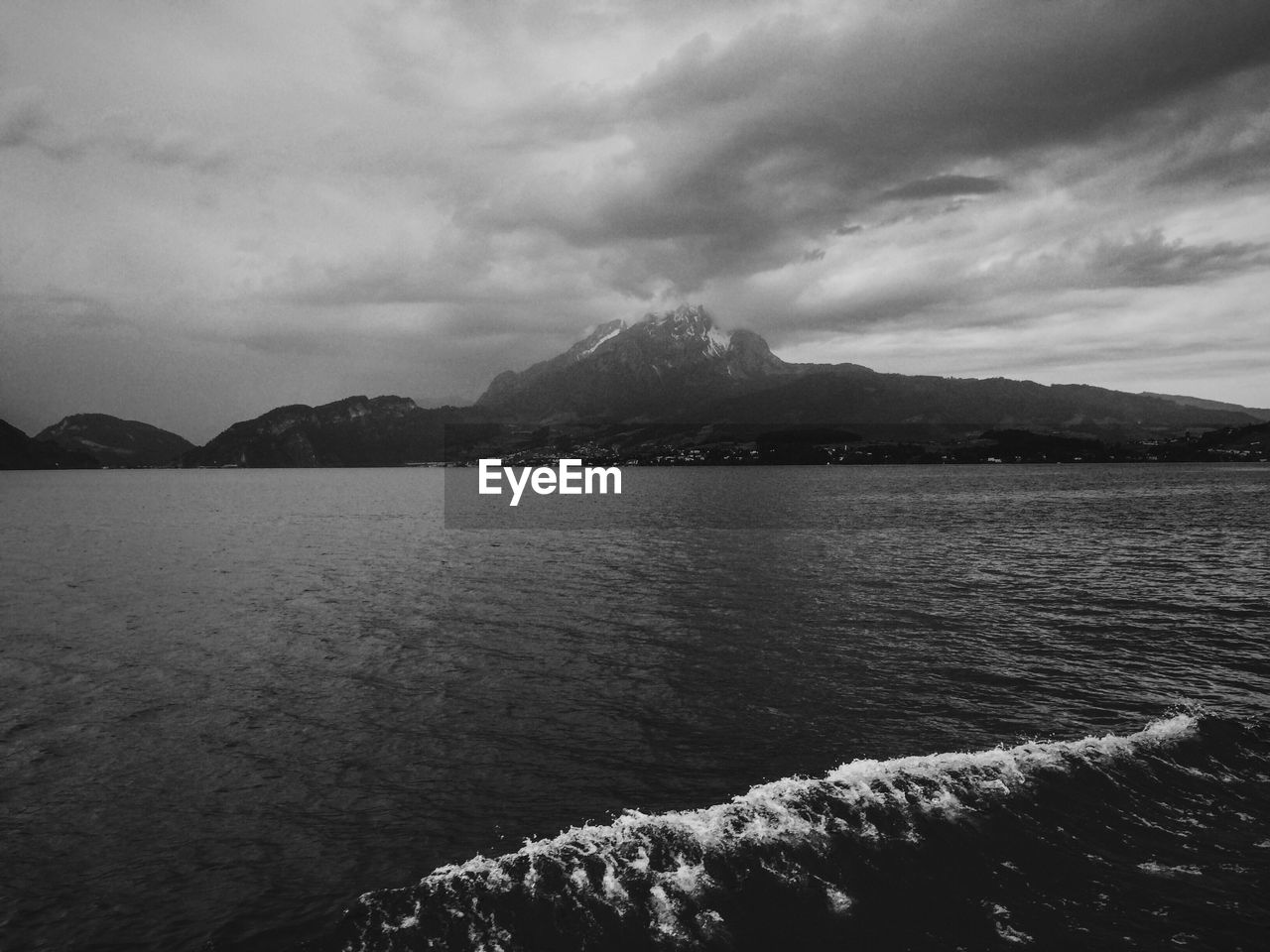 Scenic view of mountains against cloudy sky