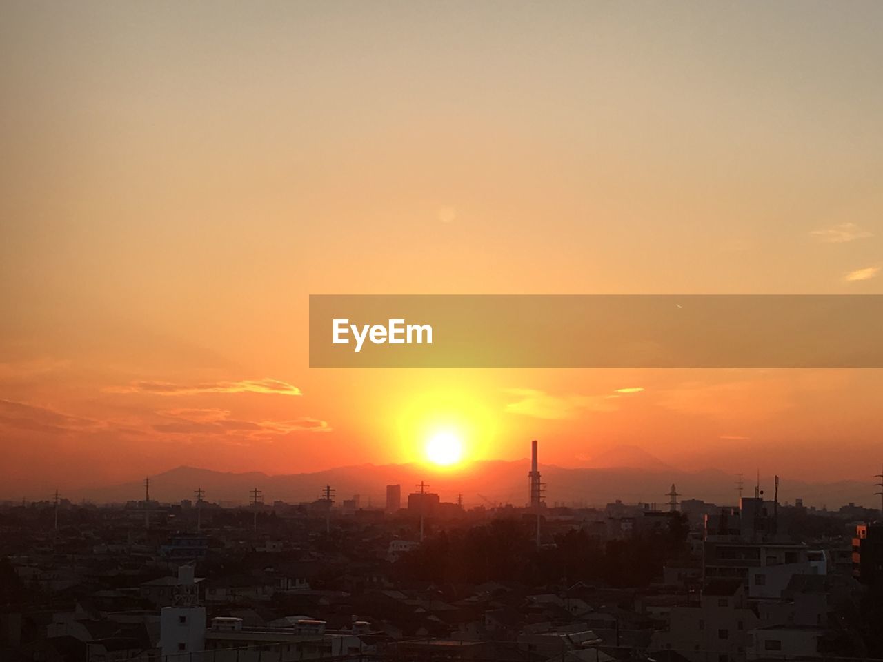 VIEW OF CITYSCAPE AT SUNSET