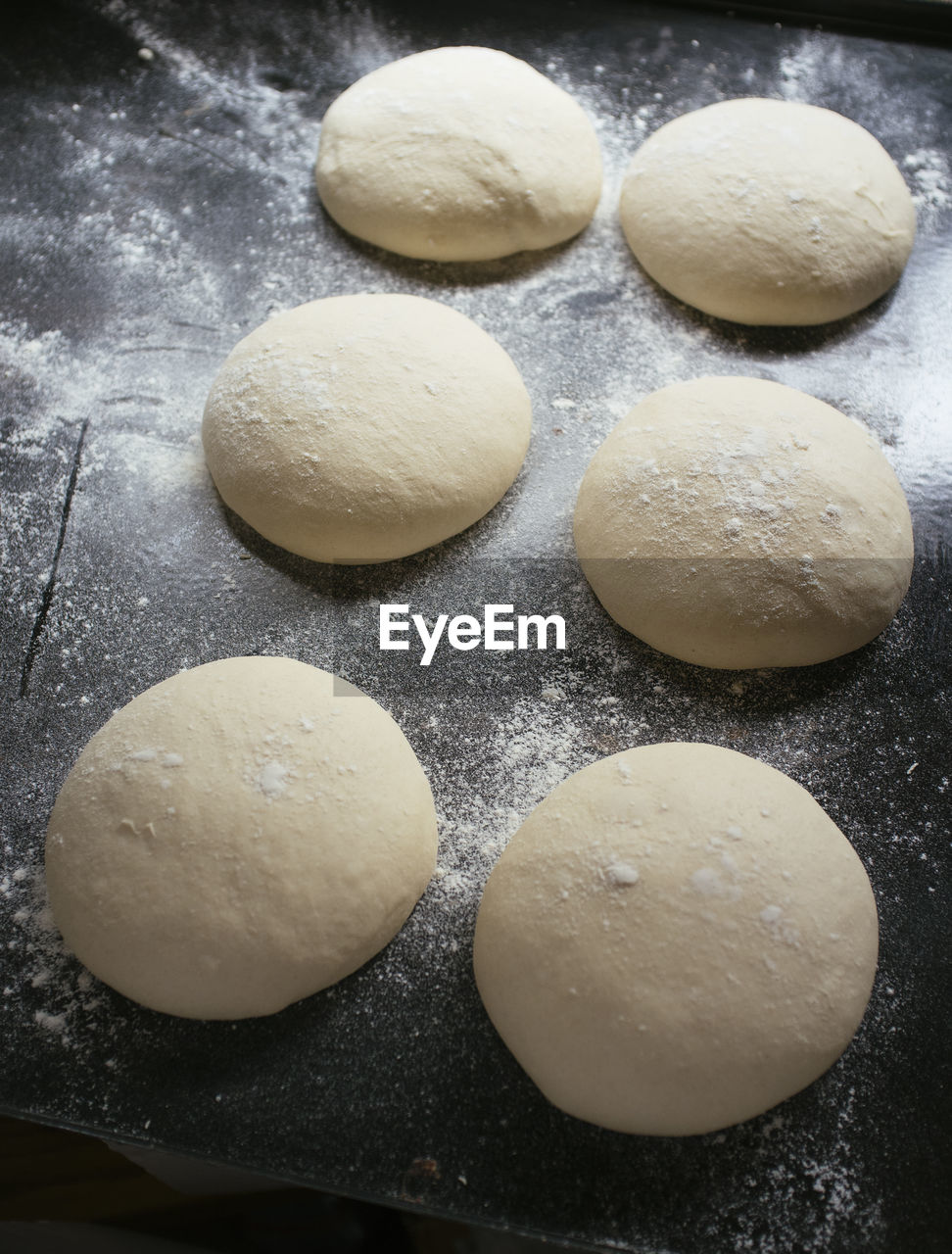 High angle view of dough in baking sheet