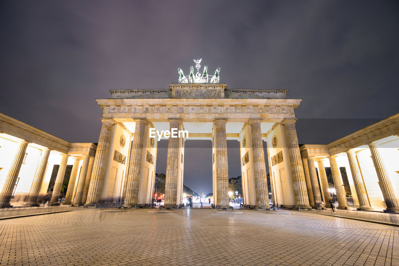 Low angle view of illuminated historical building at night