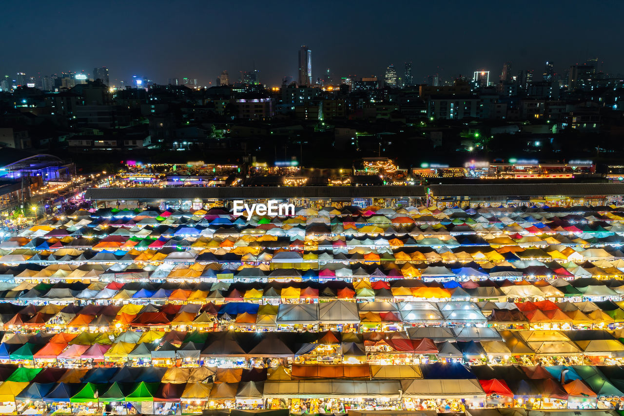 High angle view of illuminated market in city at night