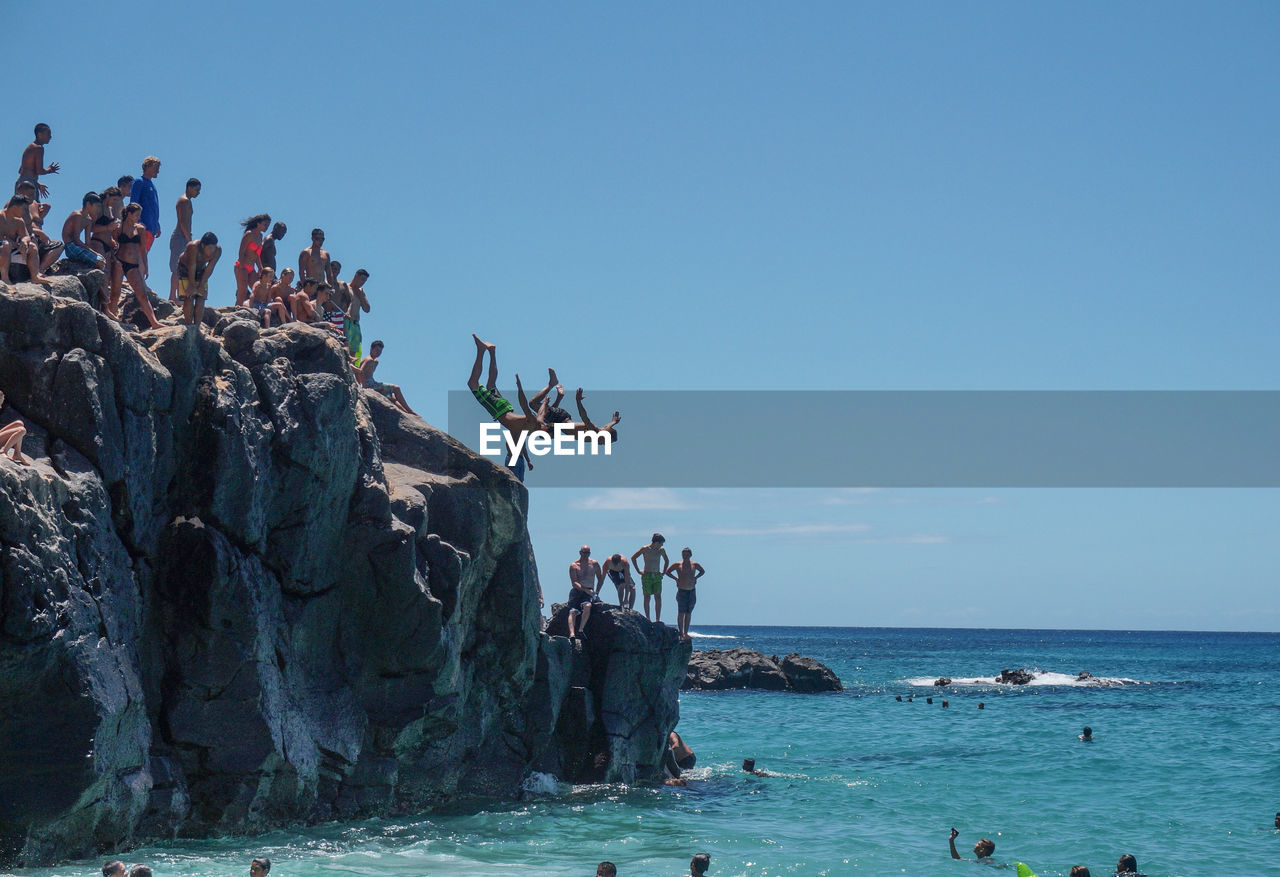 GROUP OF PEOPLE ON BEACH