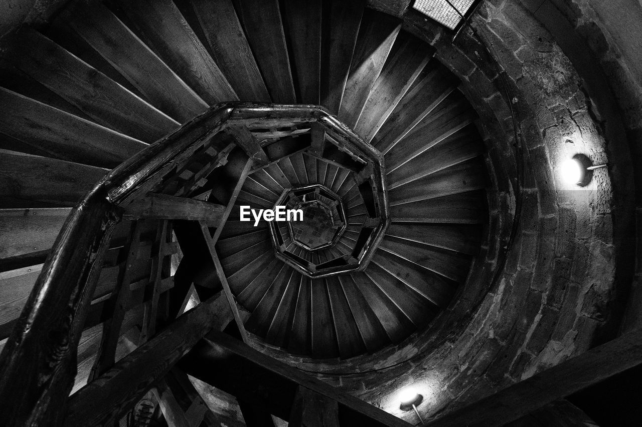 Directly above shot of spiral staircases in building