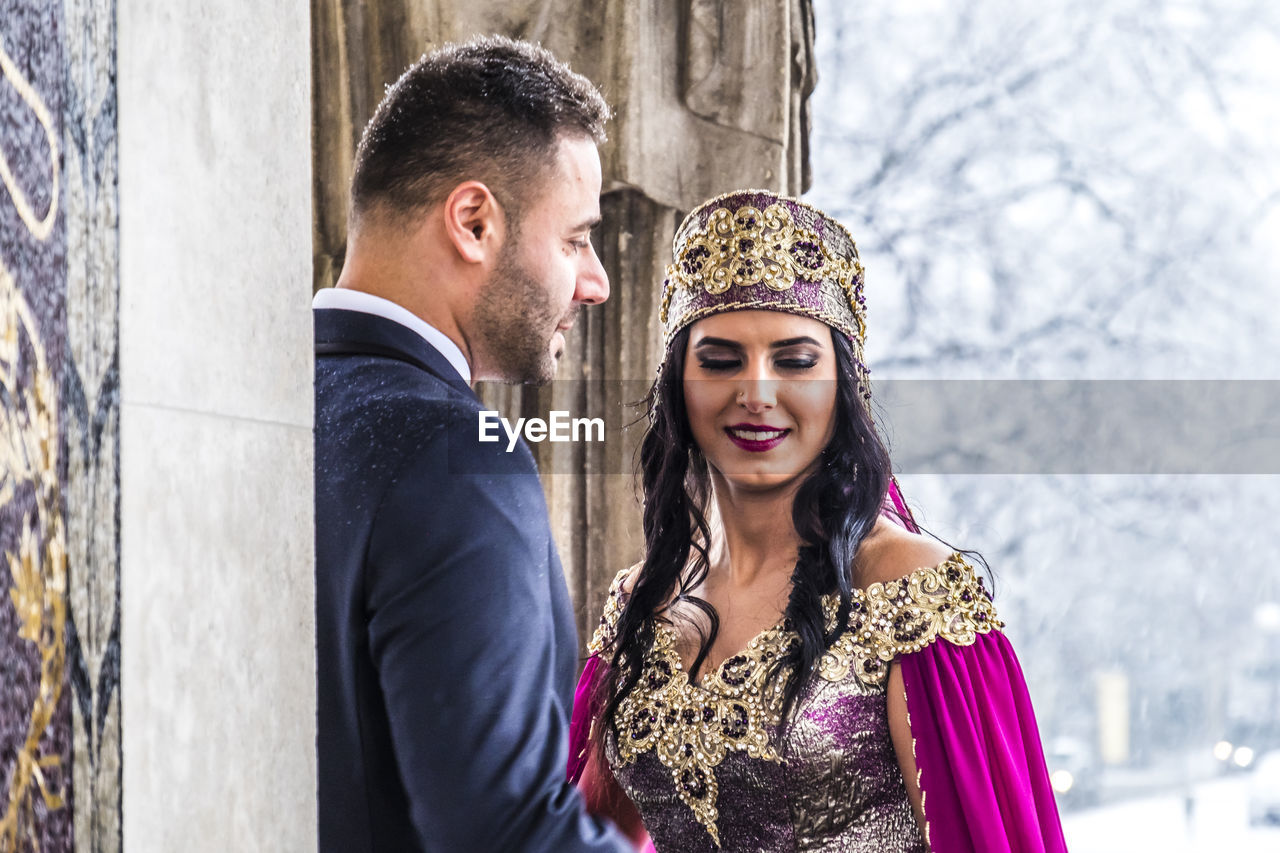 Bride with bridegroom during weeding ceremony