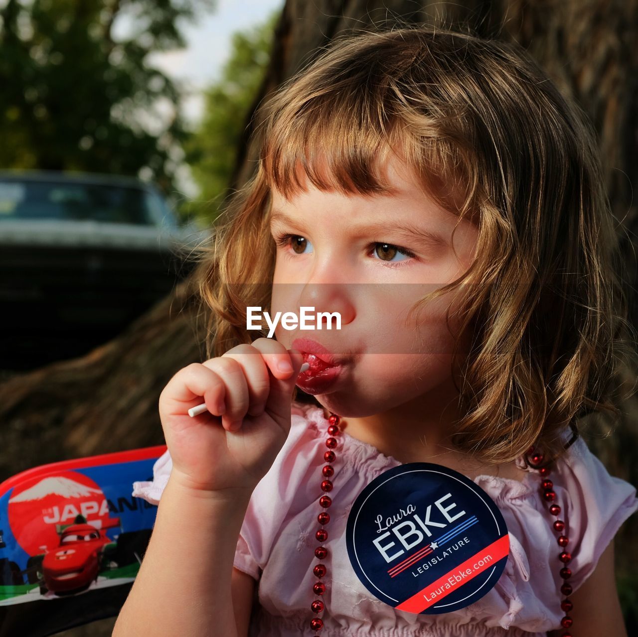 Close-up of a girl eating lollipop