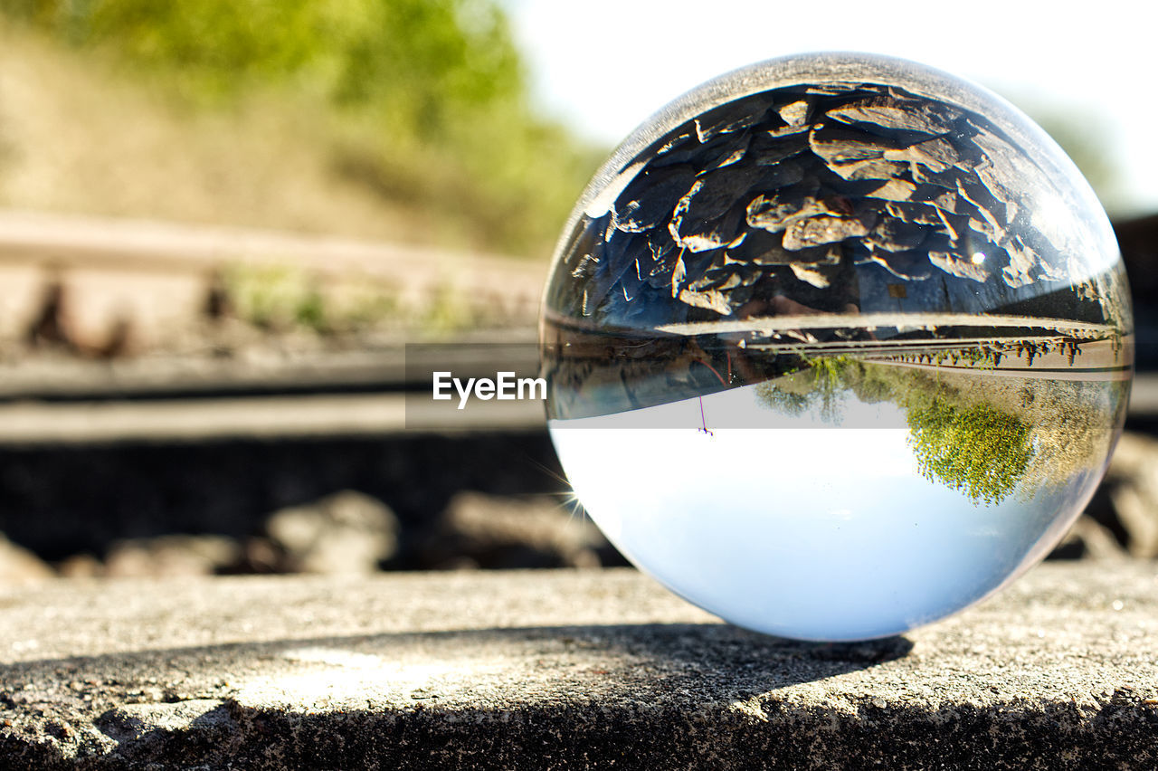 CLOSE-UP OF CRYSTAL BALL ON TABLE