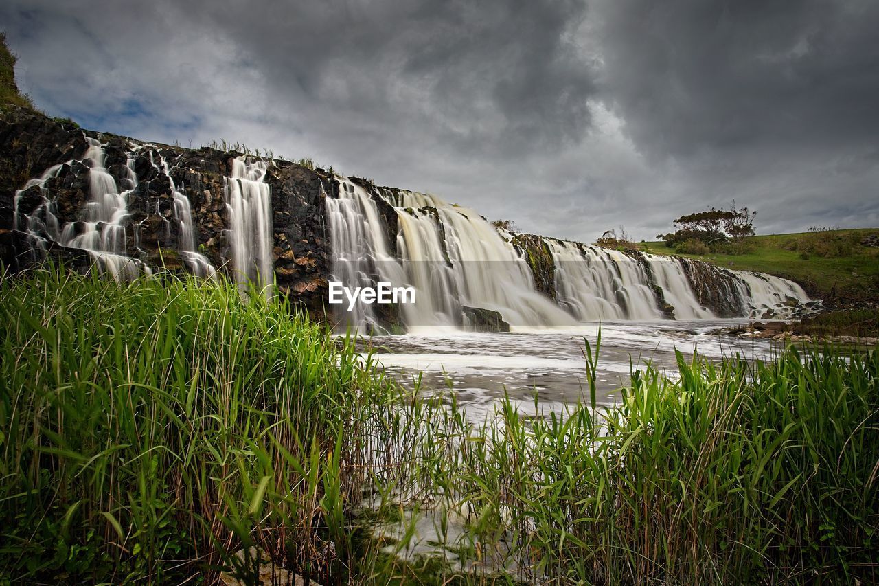 Torrent of water cascades over a waterfall