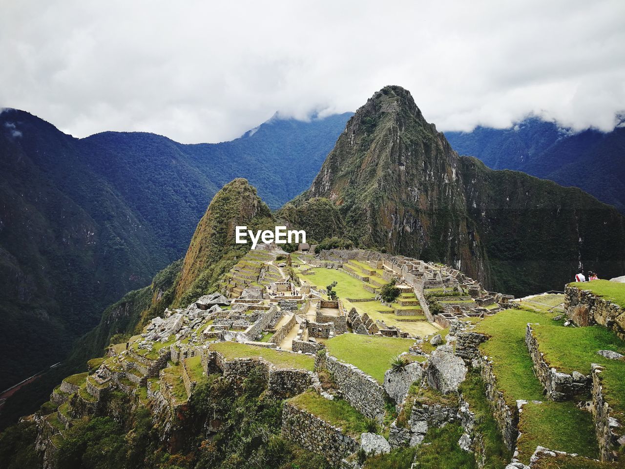 Machu picchu with mountain range in background