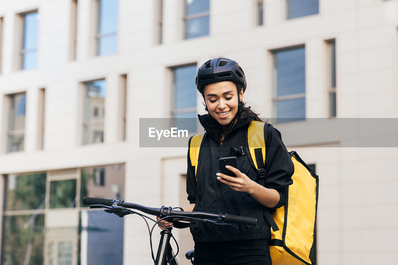 Young woman riding bicycle